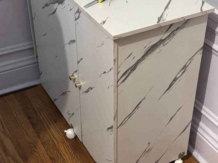 Marble-finish dresser assembly in progress