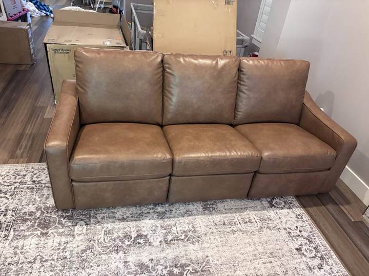 Fully assembled reclining leather sofa